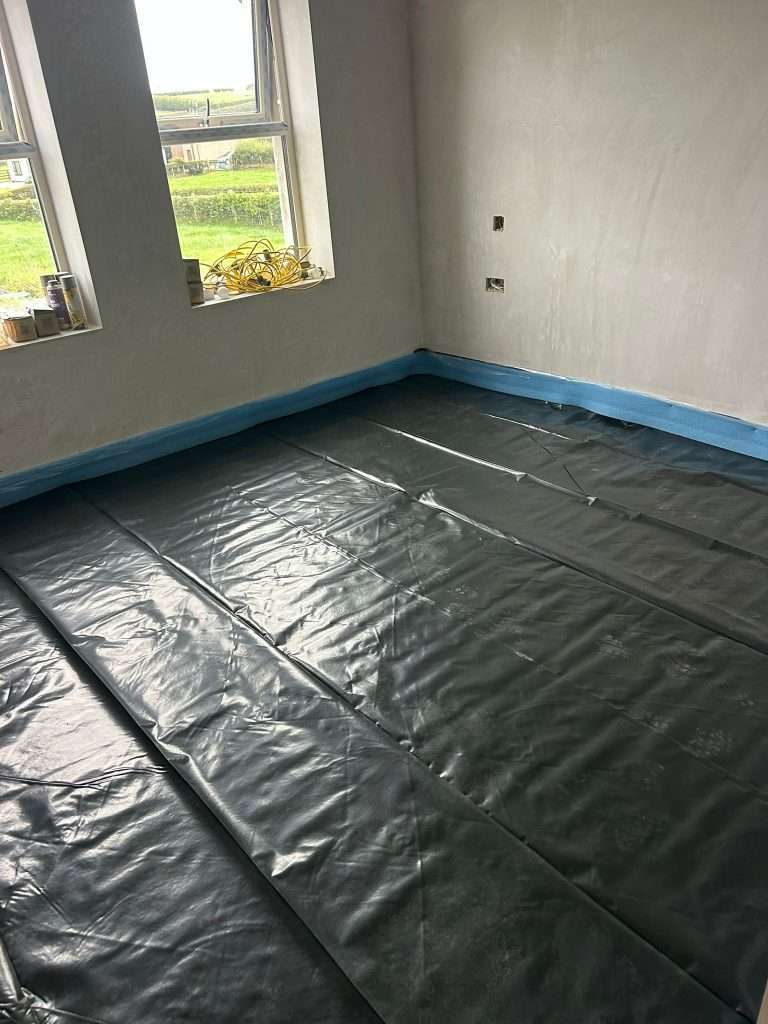 Floor preparation: polythene membrane and edge strip laid before screeding