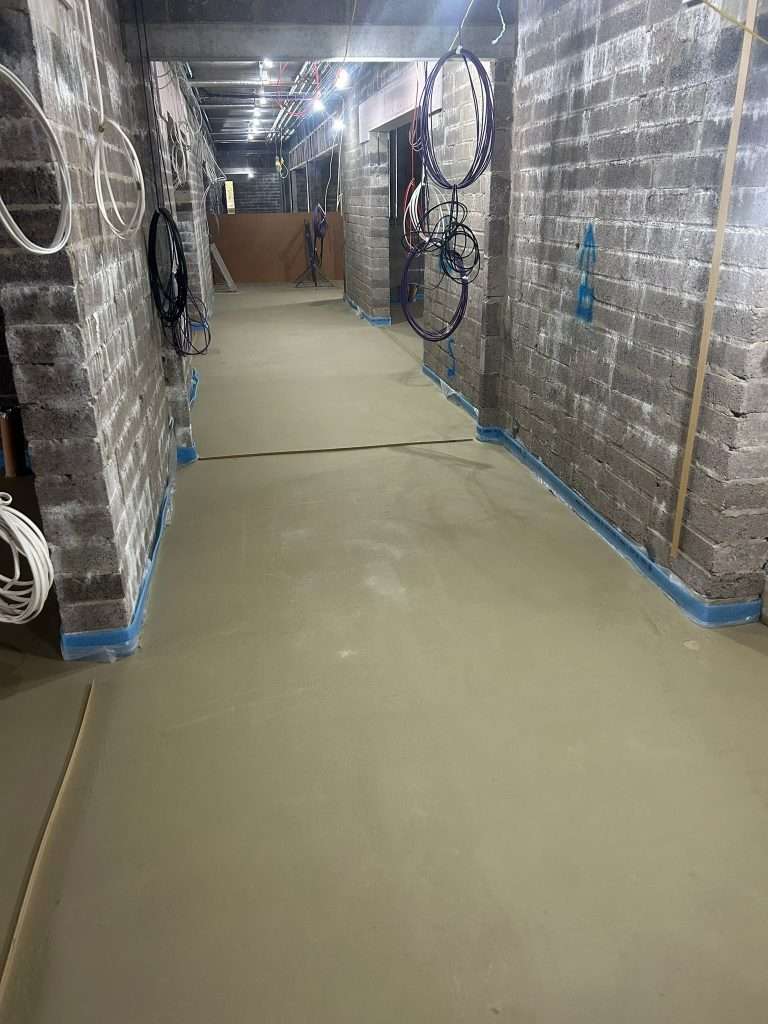 Liquid Screed poured through a block-built corridor