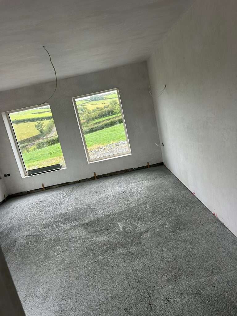 Bead Floor Insulation installed in a room with two windows